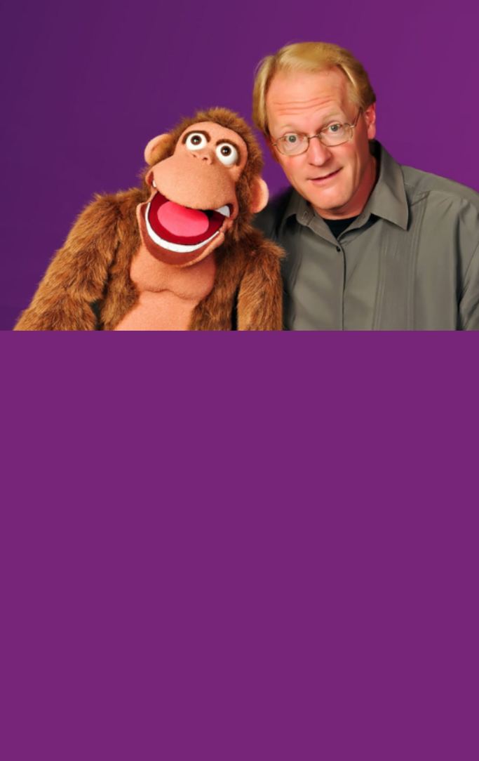 man holding monkey puppet